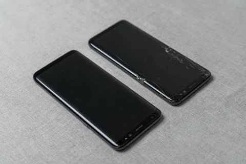 Modern touch screen smartphone with broken screen and new one Stock Photos