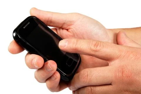 Modern touchscreen mobile phone in hand isolated on white background. Stock Photos