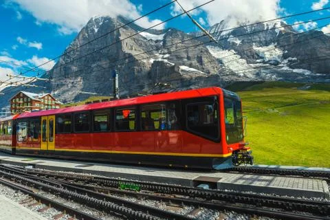 Modern tourist train in the empty train station, Grindelwald, Switzerland Stock Photos