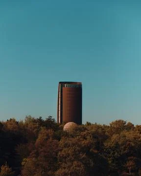 Modern Tower Overlooking a Forest Stock Photos