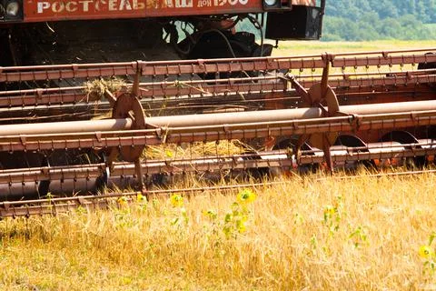 Modern tractor in the field with complex for the plowing. The concept of work in Stock Photos