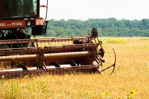 Modern tractor in the field with complex for the plowing. The concept of work in Stock Photos