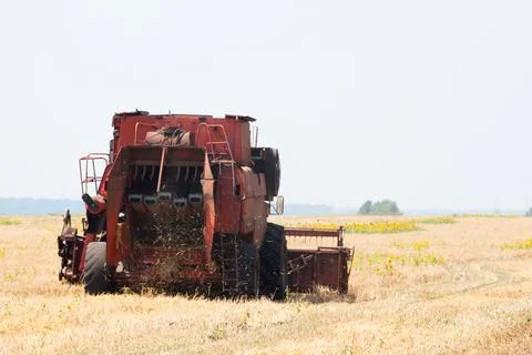 Modern tractor in the field with complex for the plowing. The concept of work in Stock Photos