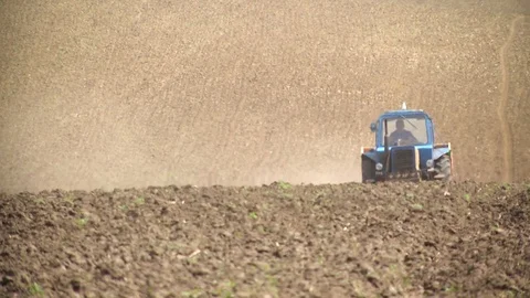 Modern tractor in the field Stock Footage 85480327