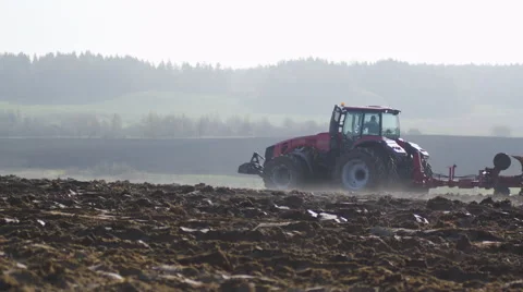 Modern tractor in the morning plowing Vídeos de archivo 64063904