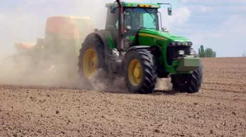Modern tractor moves with sowing machine Stock-Footage 62735255