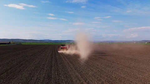 Modern Tractor with Precision Seed Drill in Agricultural Field Stock Footage 334815773