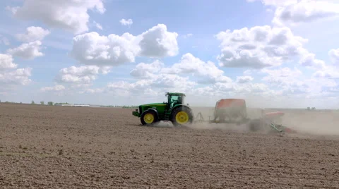 Modern tractor uses sowing machine Stock Footage 62735292