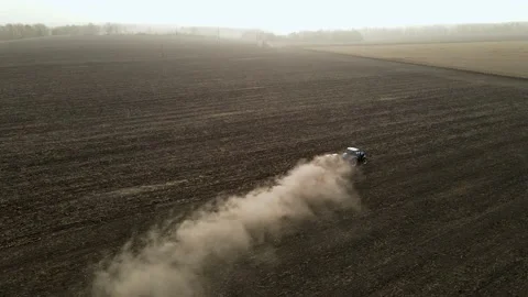 Modern tractor working plowing and sowing on the agricultural field - aerial  스톡 동영상 141903629