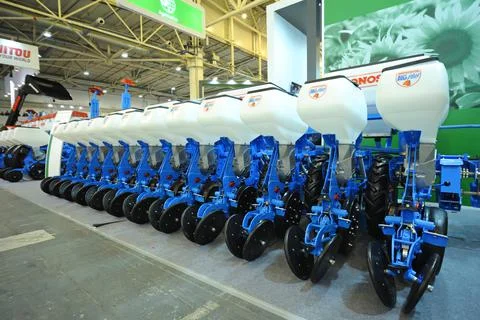 Modern trailed seeding machines placed on stand during an exhibition. Kiev, U Stock Photos