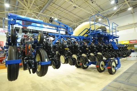 Modern trailed seeding machines placed on stand during an exhibition. Kiev, U Stock Photos