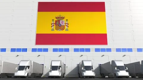 Modern trailer trucks load or unload at warehouse bays with flag of SPAIN Stock Illustration