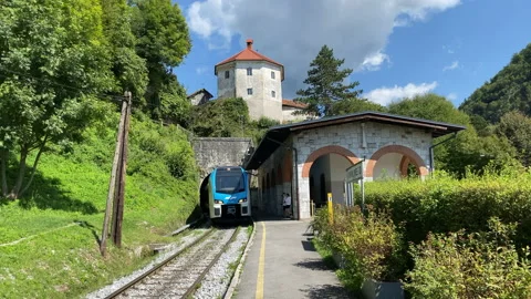 A modern train coming through the tunnel below the Alps in Slovenia, in town Stock Footage 179981812