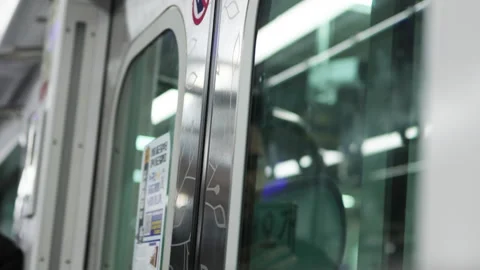 Modern train doors reflect surrounding metro life. Reliable metro system Stock Footage 322091061