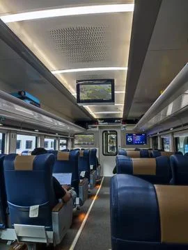 Modern train interior with blue leather seats Stock Photos