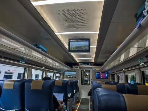 Modern train interior with blue leather seats Stock Photos