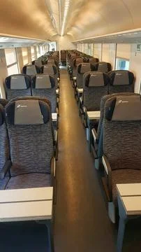 Modern Train Interior with Comfortable Seating and Minimalist Design Stock Photos