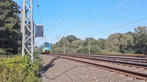 A modern train moving through a natural landscape in Germany. Stock Footage 139045232