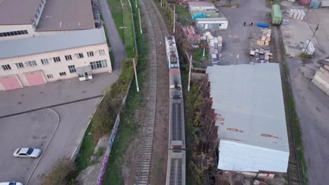 A modern train passes through the city of Almaty 스톡 동영상 255273916