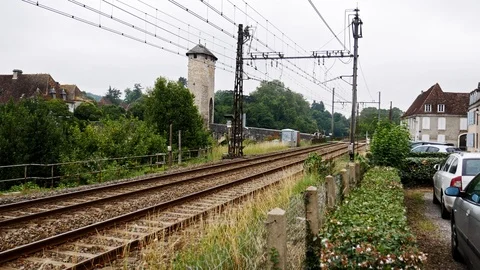 Modern train passing through an old french town Stock Footage 112074649
