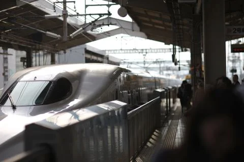 Modern train at the platform at the train station. Japan. Stock Photos