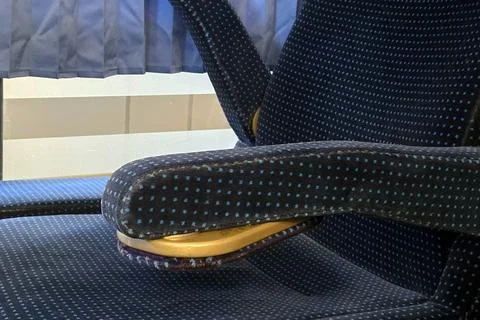 Modern Train Seat Design Featuring Polka Dot Upholstery and Adjustable Armres Stock Photos