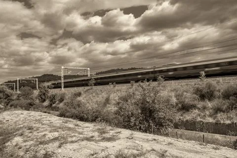 Modern Train Speeds Past Active Construction Zone Stock Photos