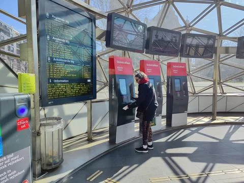 Modern train station ticket purchase moment 写真素材