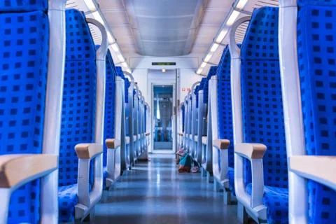 Modern Train Wagon Interior Seats Rows Blue Transportation White Daytime Trav Stock Photos