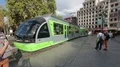 Modern tram car arriving at city square, public transportation in Bilbao, Spain HD Footage