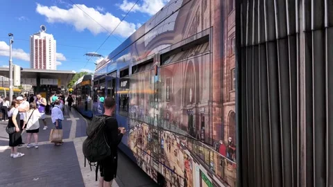 Modern Tram leaving Leipzig Central Station on sunny summer day 库存影片 338098495