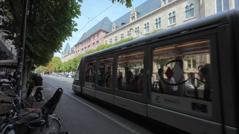 Modern Tram Moving Through the Streets of Strasbourg Stock Footage 344060679