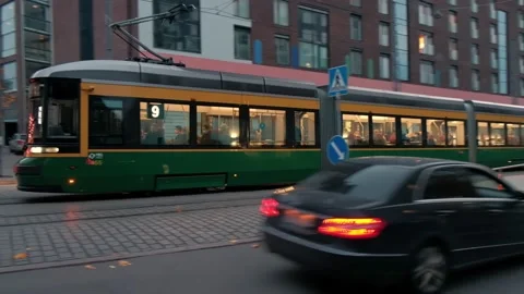 Modern Tram is moving under the bridge in Helsinki, Finland Stock Footage 163149971