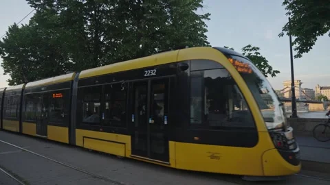 A modern tram passes the camera. Budapest, Hungary - may 31, 2025 Stock Footage 313037765