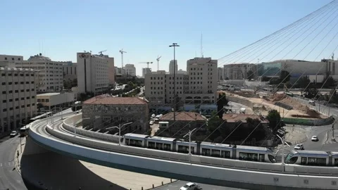 Modern Tram passing over the Chords bridge in Jerusalem Slow-mo footage 스톡 동영상 138494079