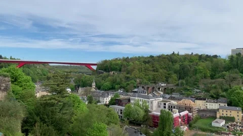 Modern trams (tramways) are crossing Charlotte bridge at Luxembourg City centre. Stock Footage 308528904