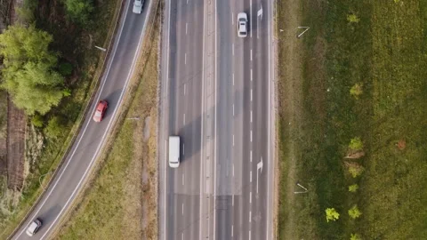 Modern transportation, top down view of a highway with green surroundings. Stock Footage 145997955