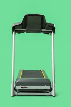 Modern treadmill on green background Stock Photos