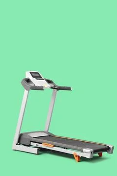Modern treadmill on green background Stock Photos