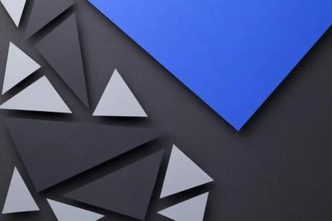 Modern Triangular Shapes Composition Over Black Paper Foto stock