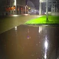 Modern trolley car moving in the street at rainy evening, urban life, metcast 4k or 4k+ Resolution