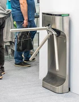 Modern turnstile security access system indoor scene, partial view of perso.. Stock Photos