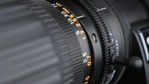 Modern TV camera lens. turning of a zoom ring montage sequence Stock Footage 102611468