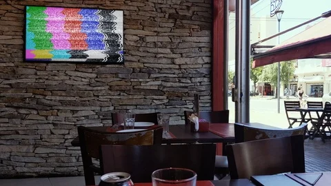 Modern TV Green Screen mounted on Wall at an Empty Bar in Buenos Aires. Stock Footage 122228643