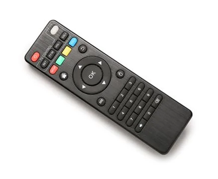 Modern TV remote controls on grey background Stock Photos