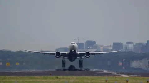 Modern twin engine airplane taking off from runway 스톡 동영상 300642174