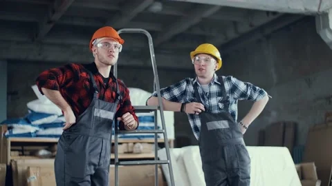 Modern with two builders discuss work for site design. Work safety. Architecture Stock Footage 130776336