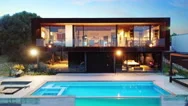 Modern Two Storey Home With Infinity Pool At Night Stock Footage