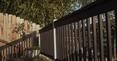 Modern Two Tone Wooden Deck Railing and Backyard Privacy Fence Stock Footage 341079000