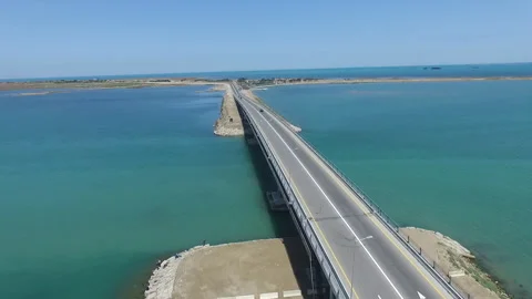 A modern type road bridge crossing the middle of the sea. Highway over sea Stock Footage 269519744